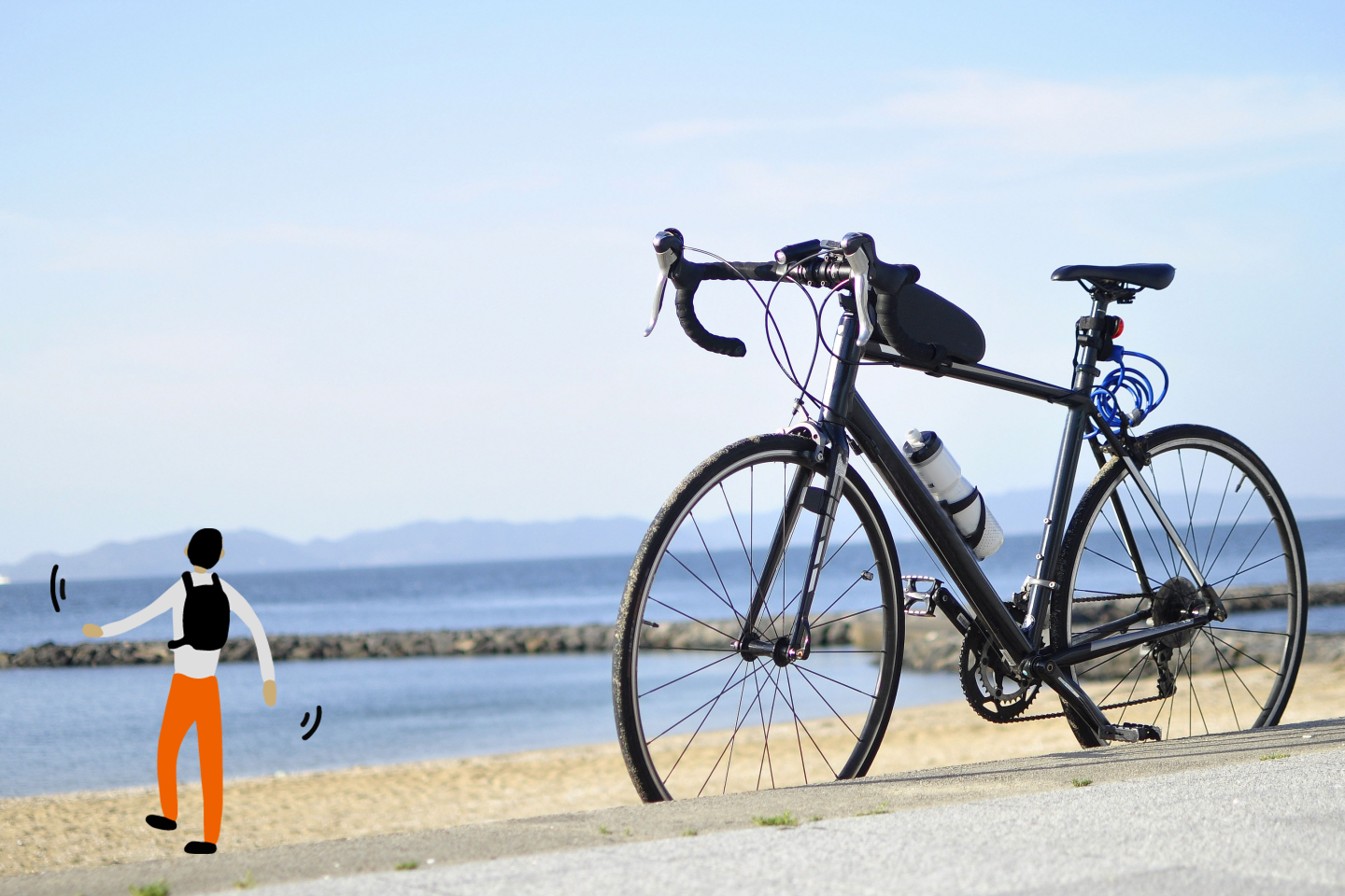 浜辺に自転車を置いて海に向かう男性